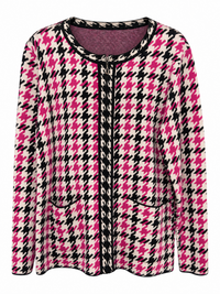 Front of Sugar Crisp SC15640 pink, black and ivory houndstooth cardigan with a round neckline, decorative metal fastening, black edging and two curved front pockets.